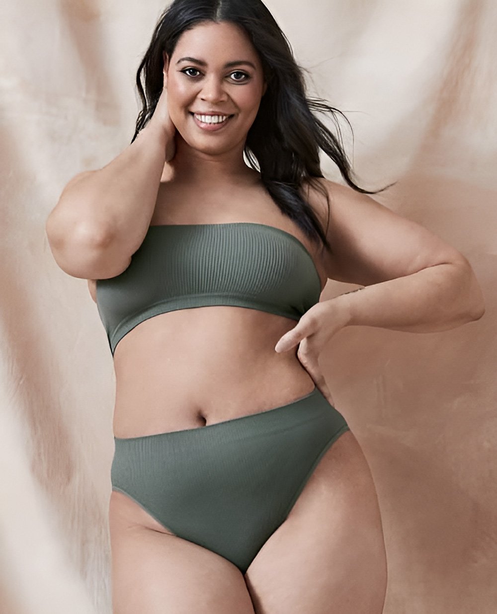 A black plus sized woman modelling seam free underwear from Target and feeling great.